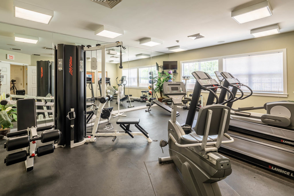 Fitness Center, a state-of-the-art facility offering a wide range of exercise equipment and amenities for residents' health and wellness needs.