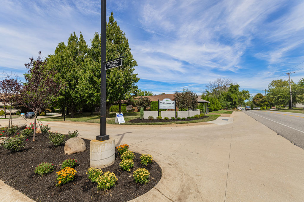 Willowood Village Apartments & Townhomes community entrance with local busstop