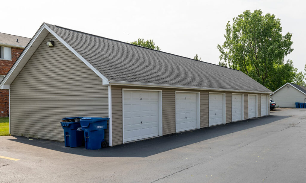 An image of a garage, a designated space for parking vehicles and storing belongings.