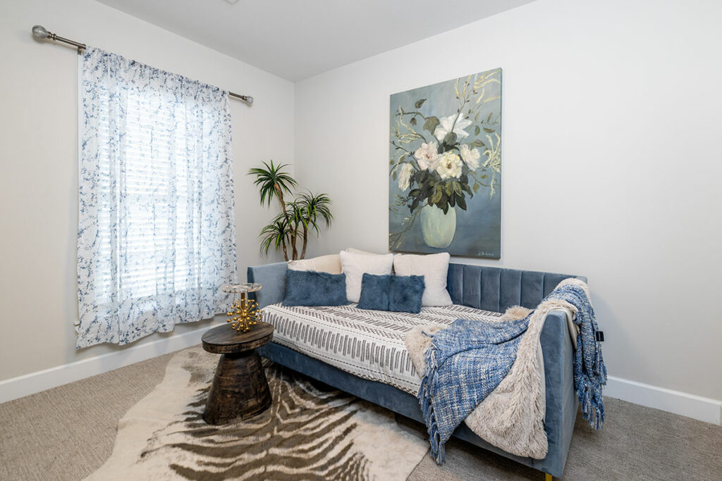An elegantly designed guest bedroom in our villa homes, featuring cozy furnishings, soft lighting, and a welcoming ambiance for a comfortable stay.