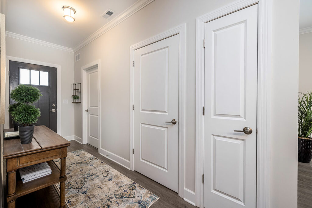 Inviting Entryway: Explore the Stylish Hallway of Our New Villa Homes, Featuring Luxury Vinyl Plank (LVP) Flooring.