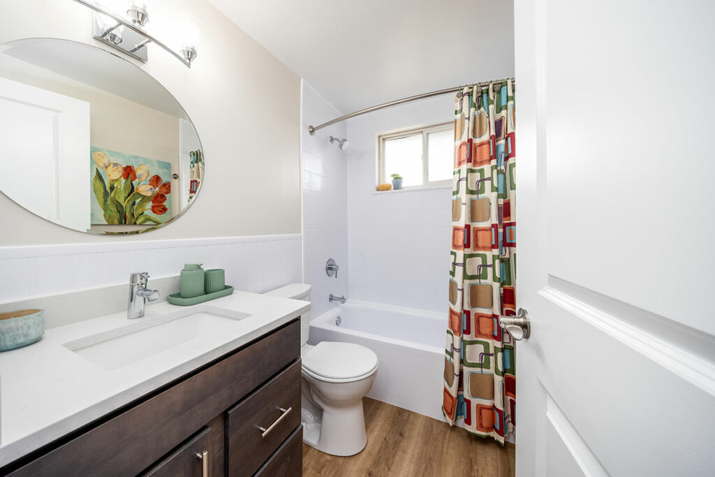 Town Hall Terrae's upgraded bathroom features modern fixtures, elegant design, and a spacious layout, offering a luxurious retreat for residents.